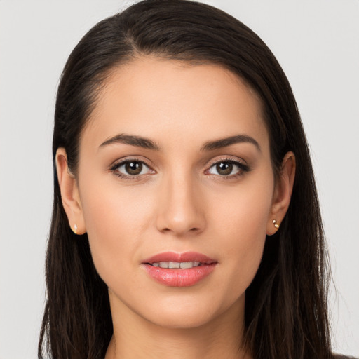 Joyful white young-adult female with long  brown hair and brown eyes