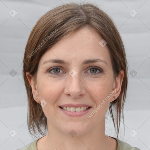 Joyful white young-adult female with medium  brown hair and grey eyes