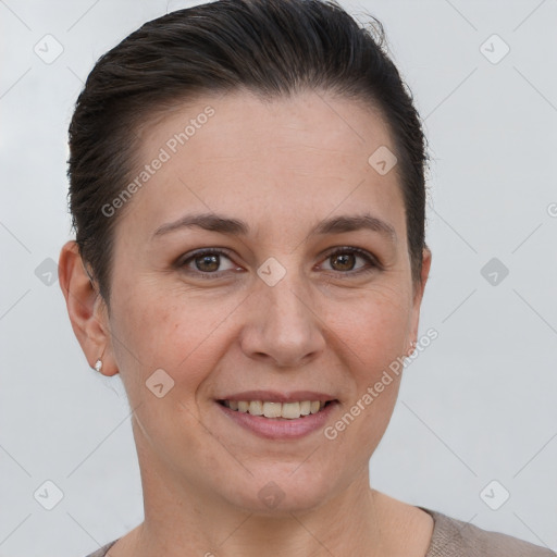 Joyful white adult female with short  brown hair and brown eyes