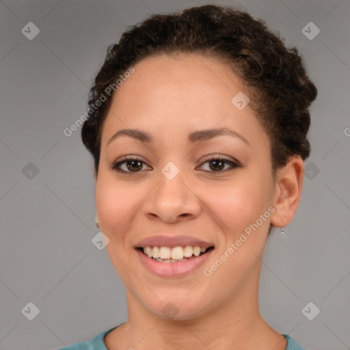 Joyful latino young-adult female with short  brown hair and brown eyes