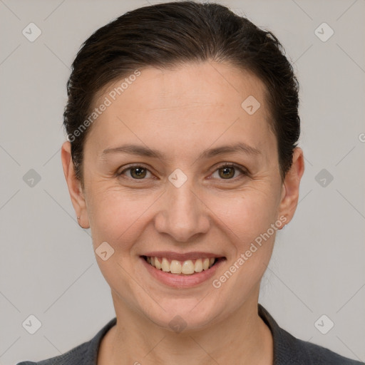 Joyful white adult female with short  brown hair and brown eyes