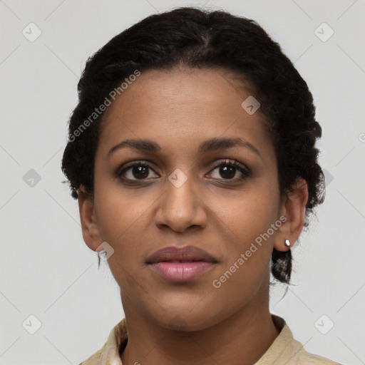 Joyful black young-adult female with short  brown hair and brown eyes