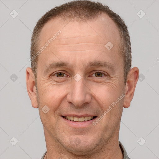 Joyful white adult male with short  brown hair and brown eyes