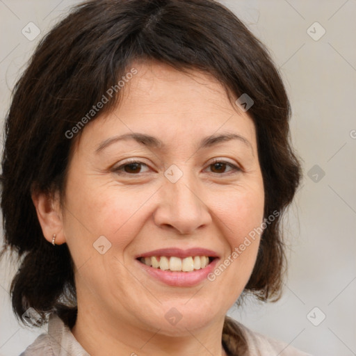 Joyful white adult female with medium  brown hair and brown eyes