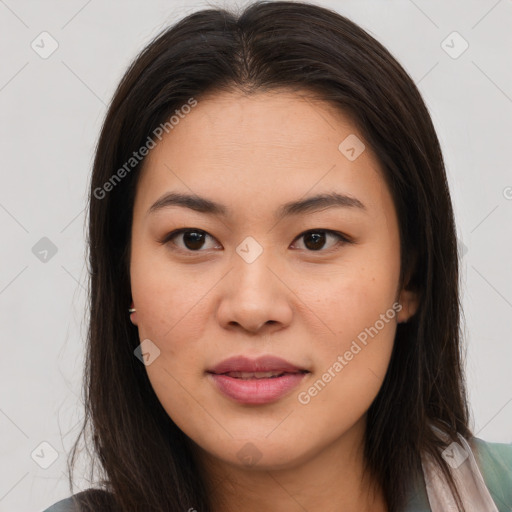 Joyful asian young-adult female with long  brown hair and brown eyes