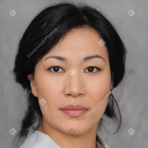 Joyful asian young-adult female with medium  black hair and brown eyes