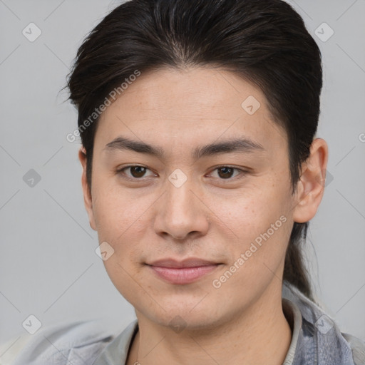 Joyful asian young-adult male with short  brown hair and brown eyes