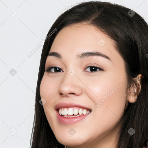 Joyful white young-adult female with long  black hair and brown eyes