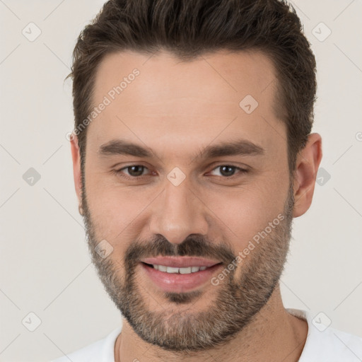 Joyful white young-adult male with short  brown hair and brown eyes