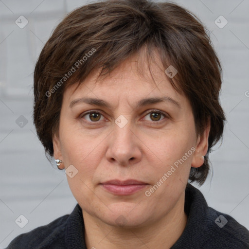 Joyful white adult female with short  brown hair and brown eyes