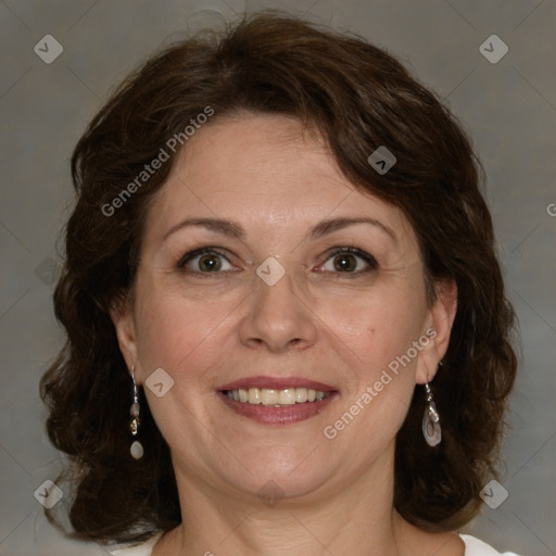 Joyful white adult female with medium  brown hair and green eyes