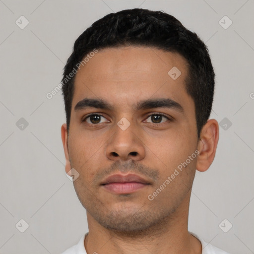 Neutral latino young-adult male with short  black hair and brown eyes