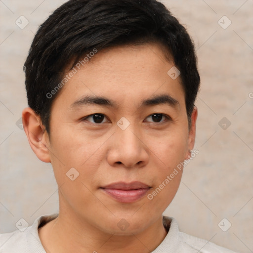 Joyful asian young-adult male with short  brown hair and brown eyes