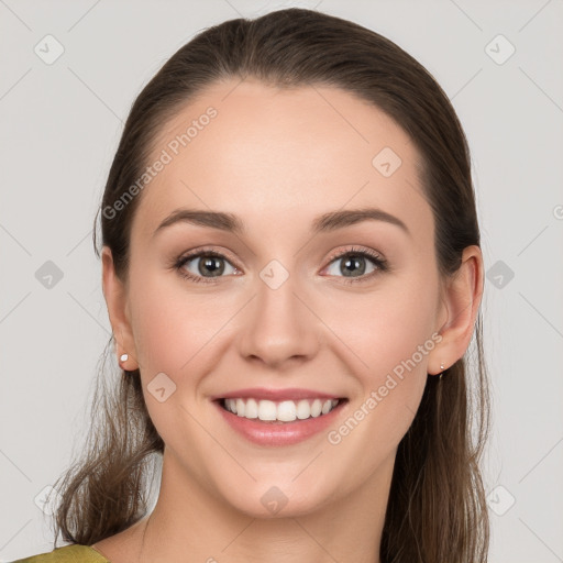 Joyful white young-adult female with long  brown hair and grey eyes