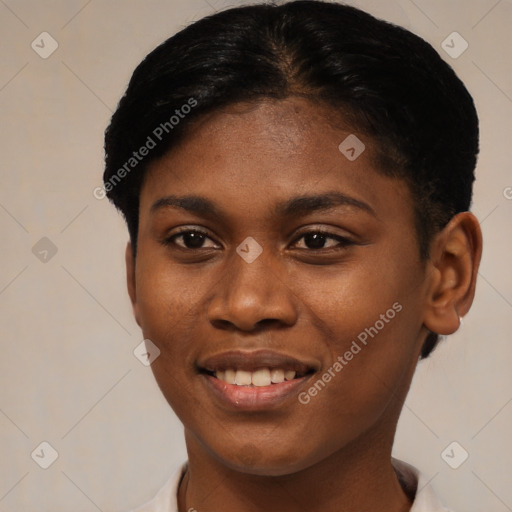 Joyful black young-adult female with short  black hair and brown eyes