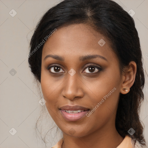 Joyful black young-adult female with medium  brown hair and brown eyes