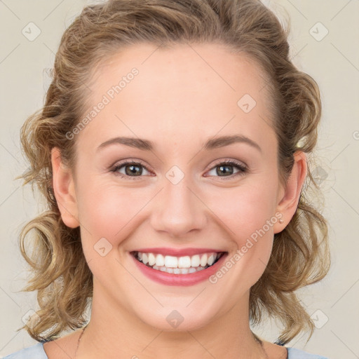 Joyful white young-adult female with medium  brown hair and blue eyes