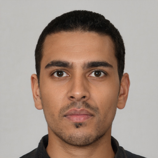 Neutral latino young-adult male with short  black hair and brown eyes