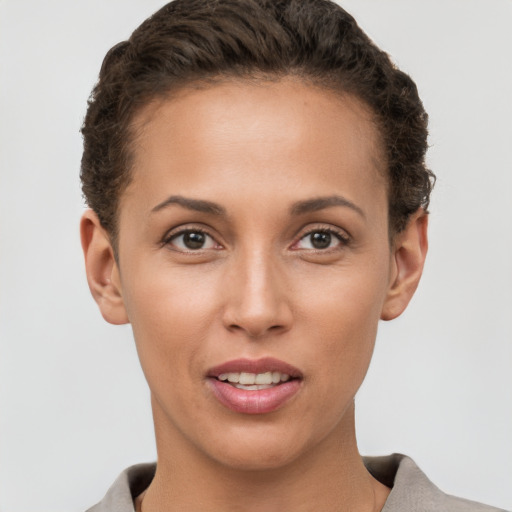 Joyful white young-adult female with short  brown hair and brown eyes