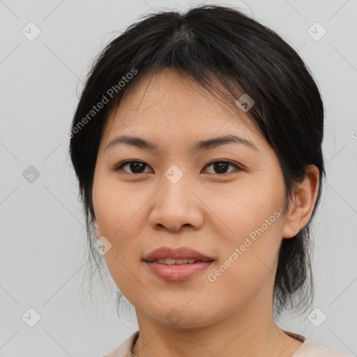 Joyful asian young-adult female with medium  brown hair and brown eyes