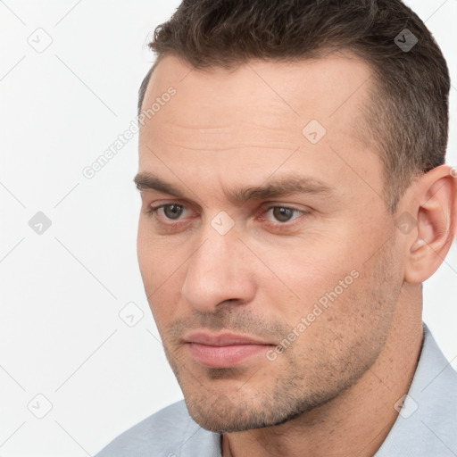 Neutral white young-adult male with short  brown hair and brown eyes