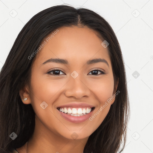 Joyful latino young-adult female with long  brown hair and brown eyes