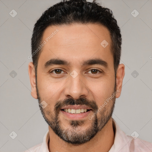 Joyful white young-adult male with short  black hair and brown eyes