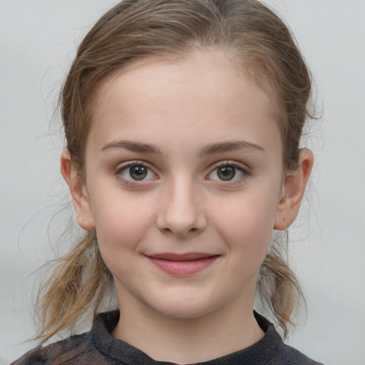 Joyful white child female with medium  brown hair and grey eyes