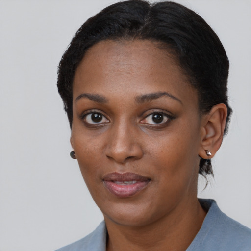 Neutral black young-adult female with short  black hair and brown eyes