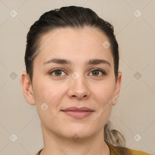 Joyful white young-adult female with short  brown hair and brown eyes