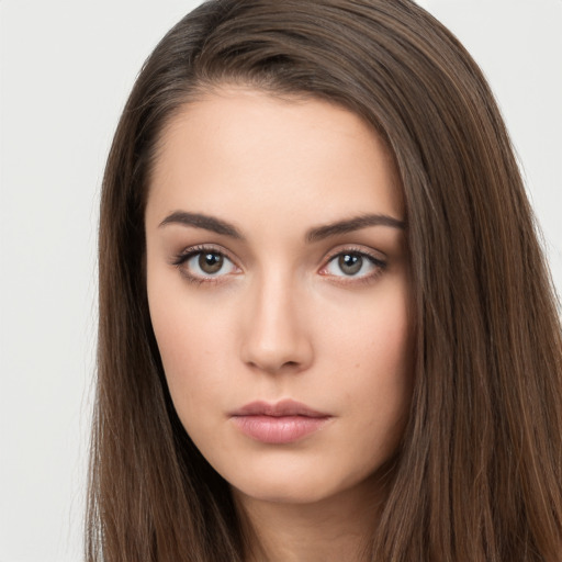 Neutral white young-adult female with long  brown hair and brown eyes