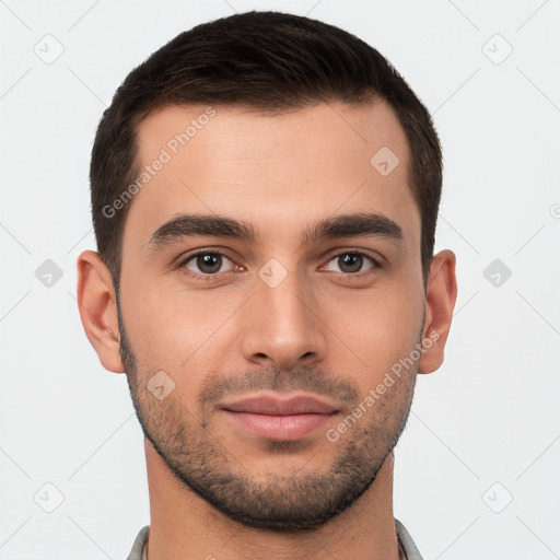 Joyful white young-adult male with short  brown hair and brown eyes