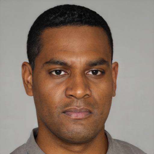 Neutral black young-adult male with short  black hair and brown eyes