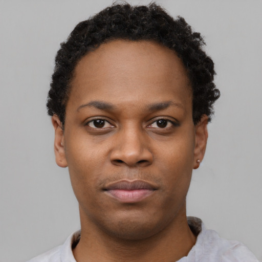 Neutral black young-adult female with short  black hair and brown eyes