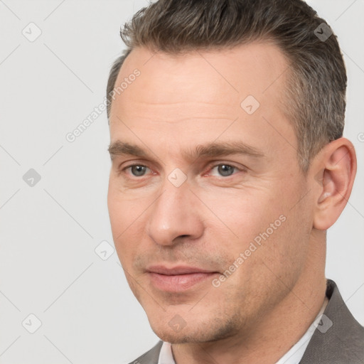 Joyful white adult male with short  brown hair and brown eyes