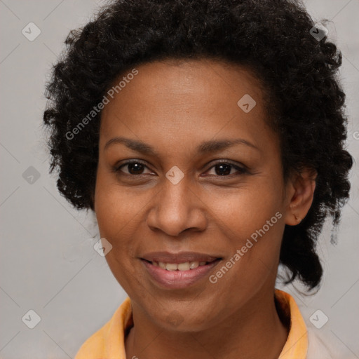 Joyful black adult female with short  brown hair and brown eyes