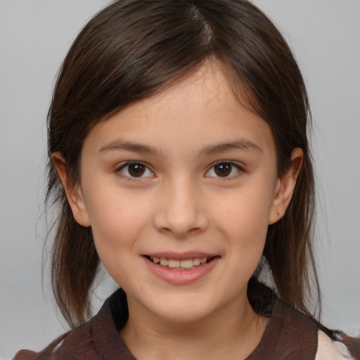 Joyful white child female with medium  brown hair and brown eyes