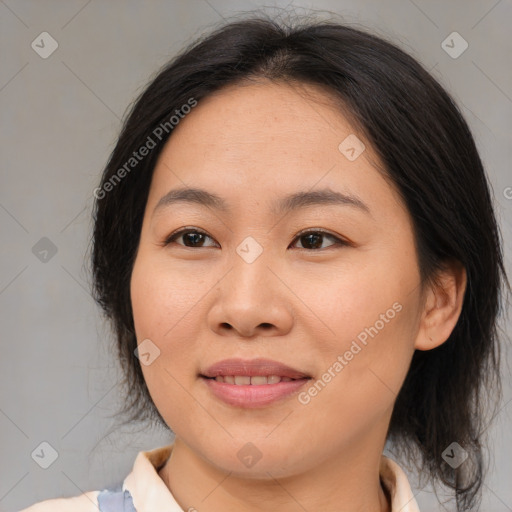 Joyful asian young-adult female with medium  brown hair and brown eyes