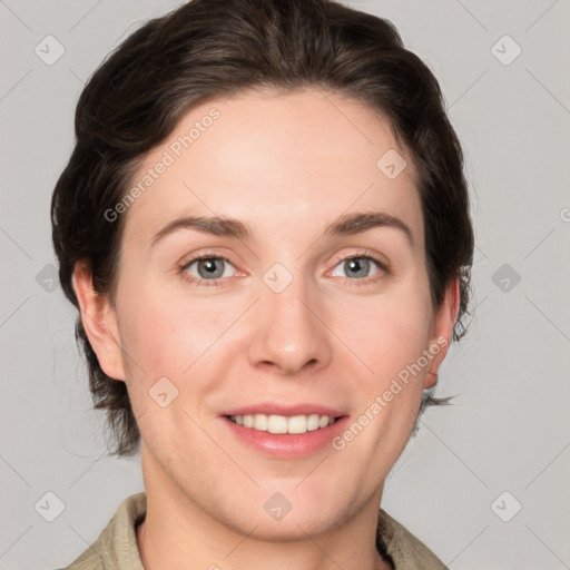 Joyful white young-adult female with medium  brown hair and grey eyes