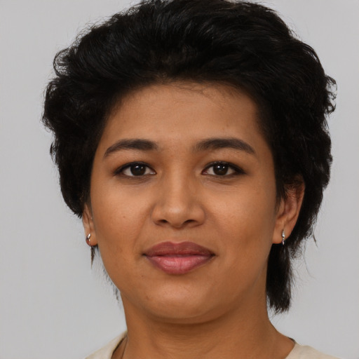 Joyful latino young-adult female with medium  black hair and brown eyes