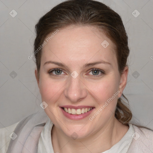 Joyful white young-adult female with medium  brown hair and blue eyes