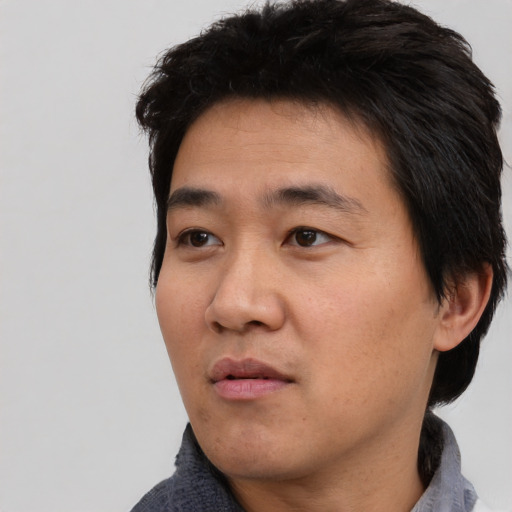 Neutral asian young-adult male with short  black hair and brown eyes