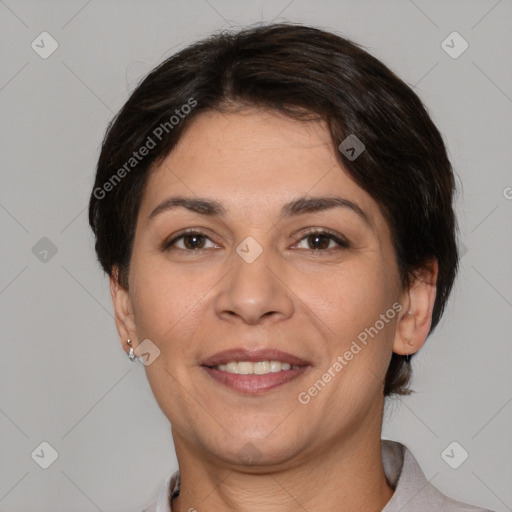 Joyful white adult female with short  brown hair and brown eyes