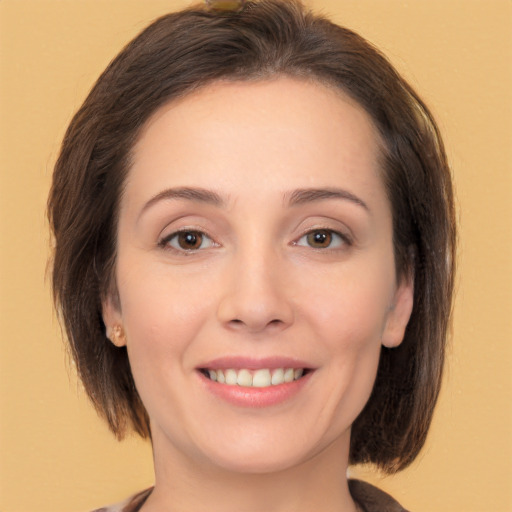 Joyful white young-adult female with medium  brown hair and brown eyes