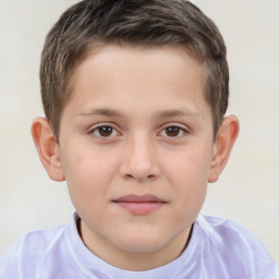 Joyful white child male with short  brown hair and brown eyes