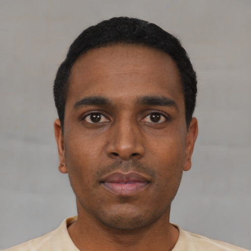Neutral black young-adult male with short  black hair and brown eyes