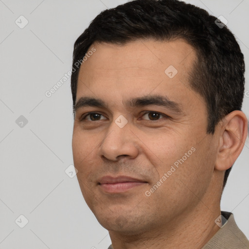 Joyful white young-adult male with short  black hair and brown eyes