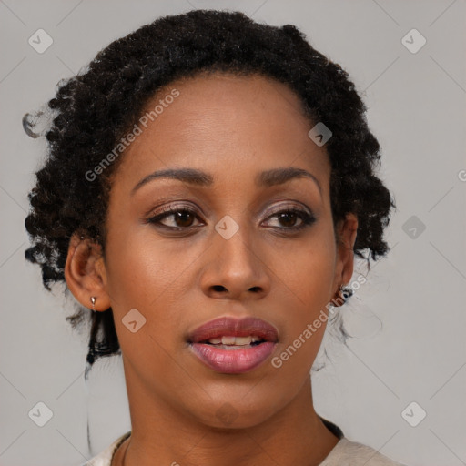 Joyful black young-adult female with medium  brown hair and brown eyes