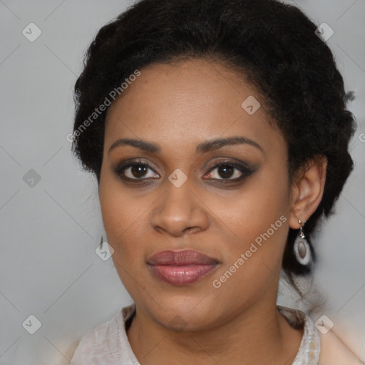 Joyful black young-adult female with medium  black hair and brown eyes