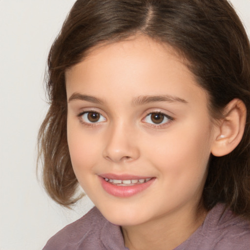 Joyful white child female with medium  brown hair and brown eyes